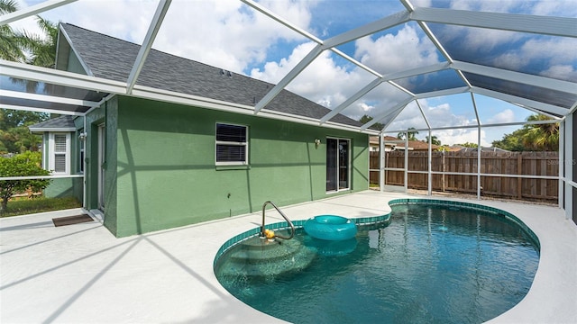 view of swimming pool with a lanai and a patio