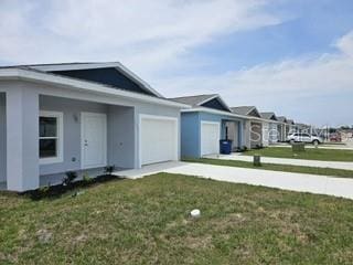 exterior space with a lawn and a garage