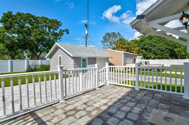 view of patio / terrace featuring a storage unit