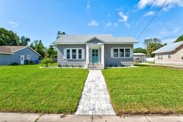 bungalow with a front yard