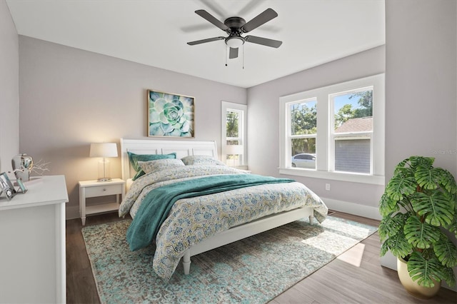 bedroom featuring ceiling fan and wood-type flooring