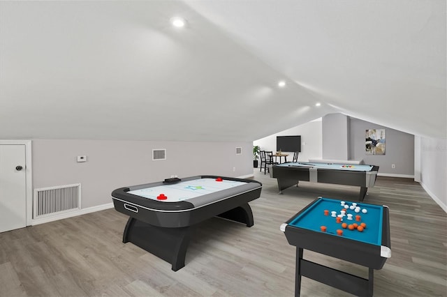 rec room featuring light wood-type flooring, billiards, and vaulted ceiling