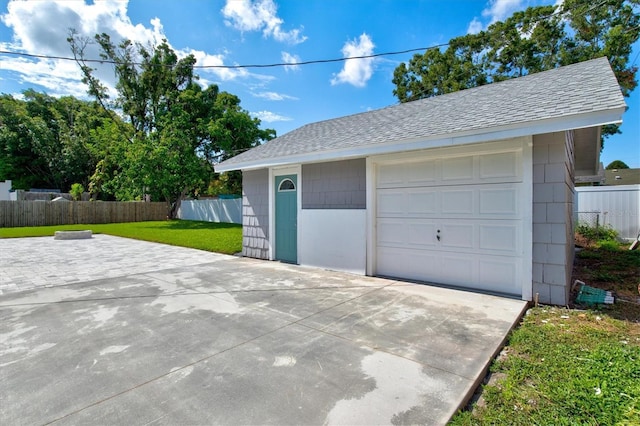 garage with a yard