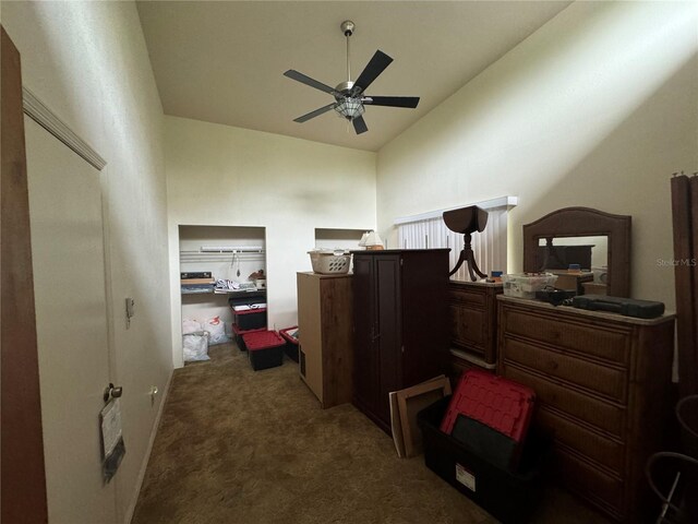 carpeted bedroom with vaulted ceiling and ceiling fan