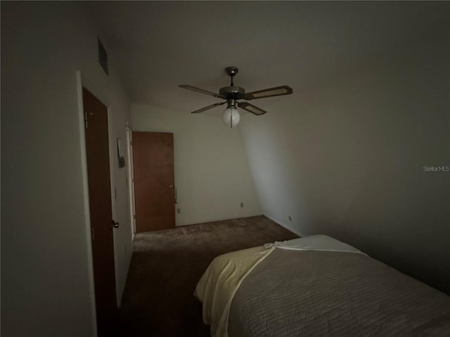 carpeted bedroom with ceiling fan and lofted ceiling