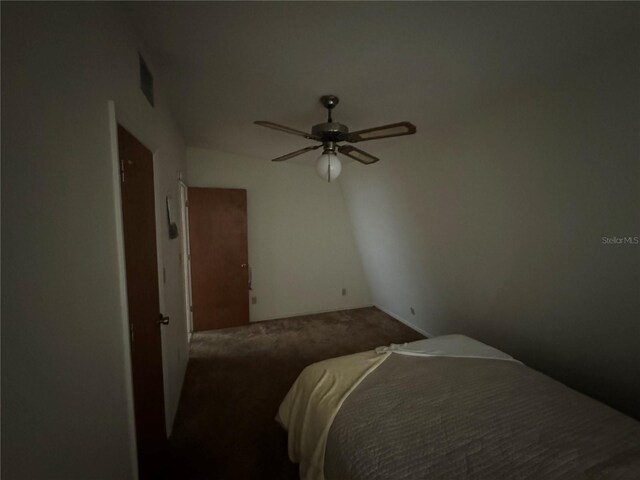 bedroom featuring ceiling fan and carpet