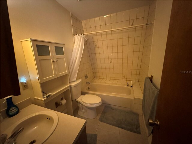 full bathroom with vanity, tile patterned flooring, toilet, and shower / bath combo with shower curtain