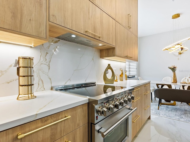 kitchen featuring extractor fan, stainless steel range, modern cabinets, and backsplash