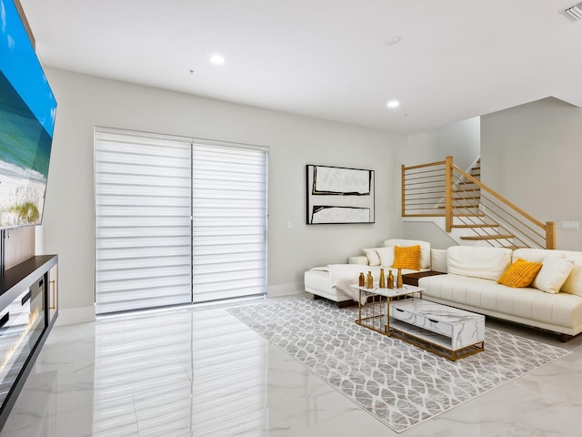 living room featuring marble finish floor, stairway, visible vents, and recessed lighting