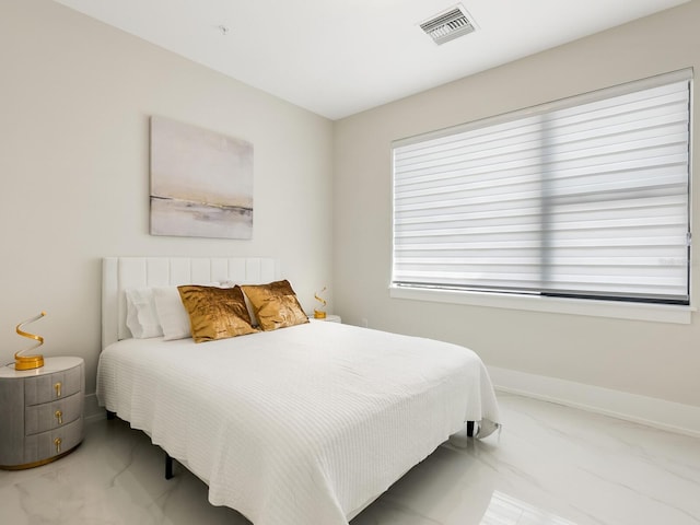 bedroom with marble finish floor, baseboards, and visible vents