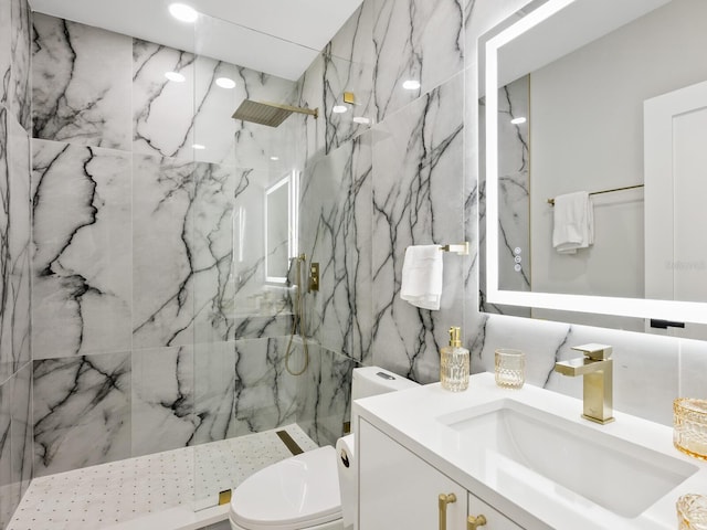 full bath featuring toilet, a marble finish shower, vanity, and tile walls