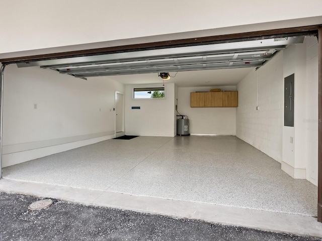 garage with a garage door opener, electric panel, and water heater