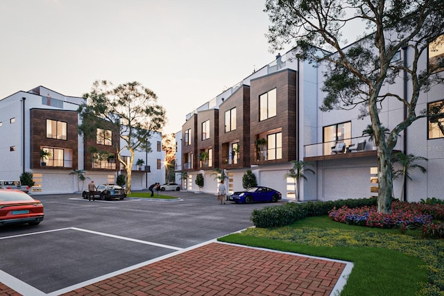 view of property featuring uncovered parking and a residential view