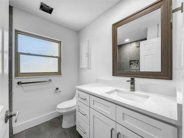 bathroom featuring a tile shower, baseboards, toilet, tile patterned floors, and vanity