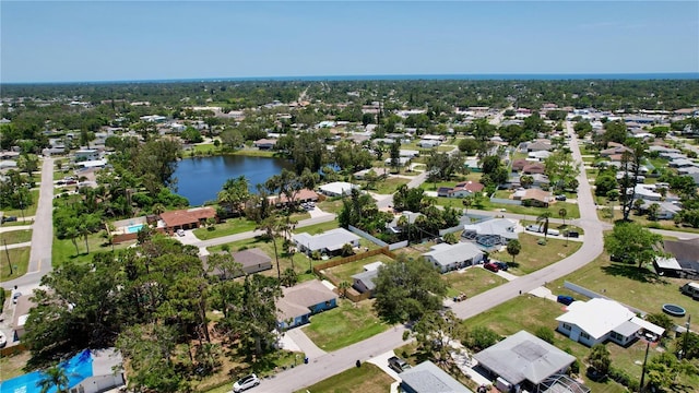 aerial view featuring a water view and a residential view