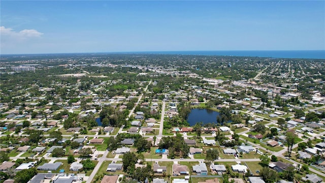 bird's eye view featuring a residential view and a water view