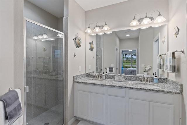 ensuite bathroom featuring a stall shower, a sink, and ensuite bath