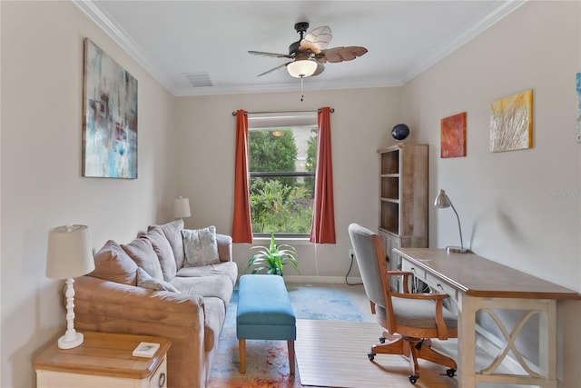 office space with visible vents, ornamental molding, a ceiling fan, and baseboards