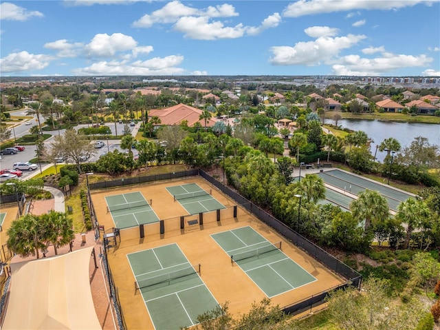 birds eye view of property with a water view and a residential view