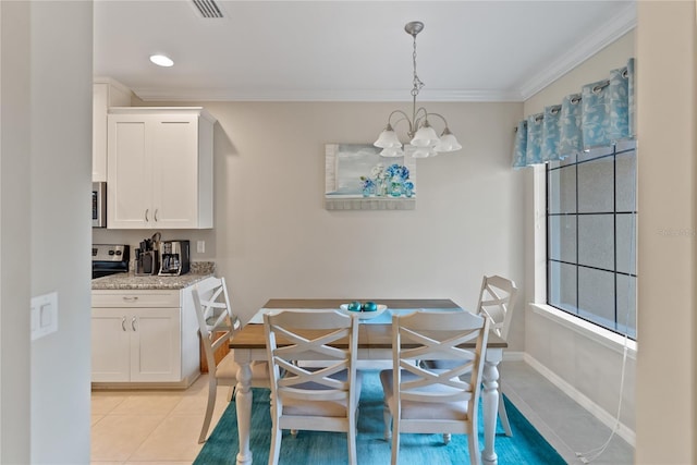 dining space with light tile patterned floors, a chandelier, visible vents, baseboards, and crown molding