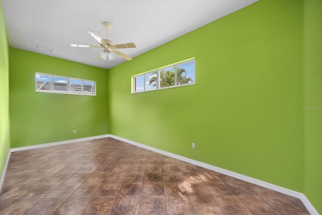 unfurnished room with ceiling fan