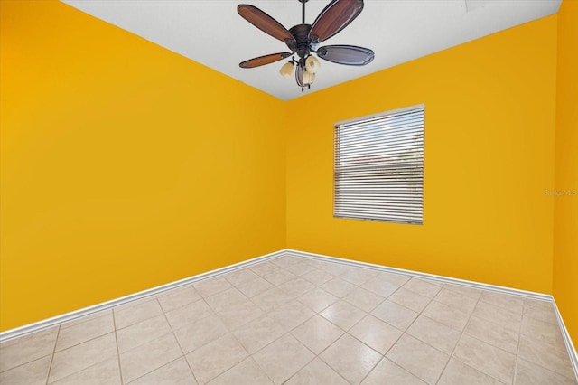 tiled empty room with ceiling fan