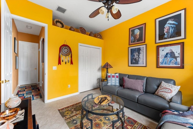 living room featuring ceiling fan and light tile patterned floors