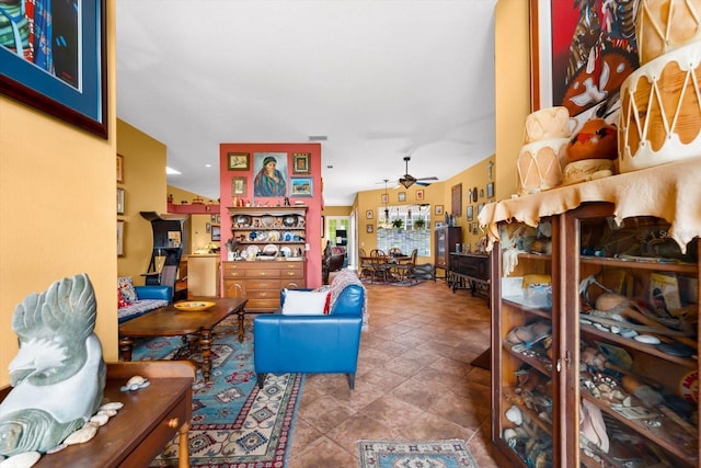 tiled living room with ceiling fan