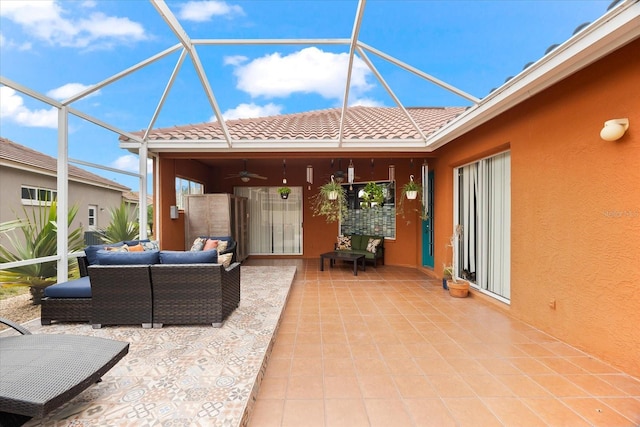 view of patio / terrace with ceiling fan, a lanai, and an outdoor living space