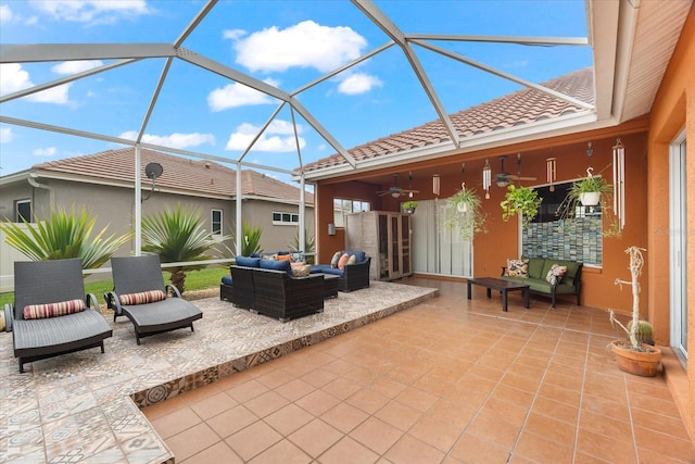 view of patio / terrace featuring outdoor lounge area and glass enclosure