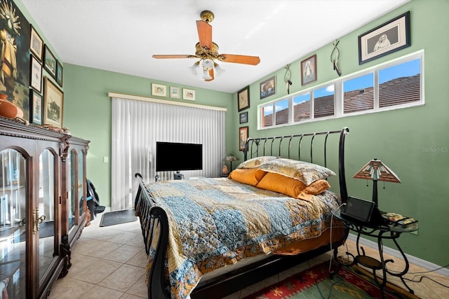 tiled bedroom with ceiling fan