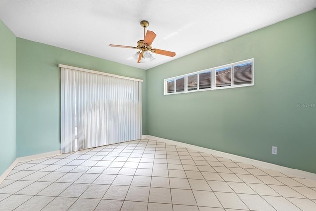 unfurnished room featuring ceiling fan and light tile patterned floors