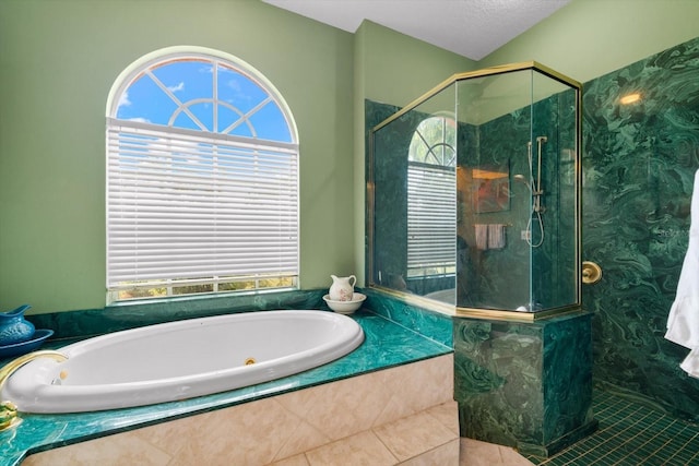 bathroom with separate shower and tub, tile patterned flooring, and a healthy amount of sunlight