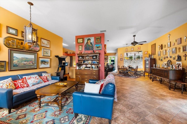 tiled living room featuring ceiling fan