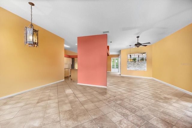 unfurnished living room featuring ceiling fan and light tile patterned floors