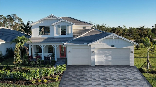 view of front of house with a front yard and a garage