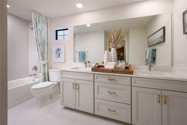 full bathroom featuring toilet, dual vanity, tiled shower / bath, and tile patterned floors