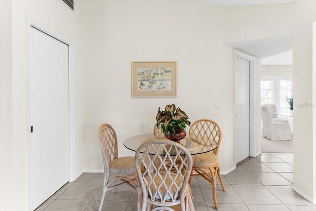 dining space featuring light tile patterned floors