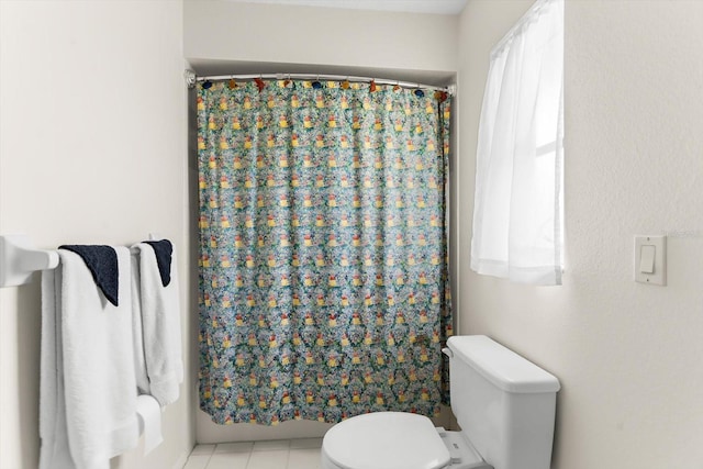 bathroom featuring toilet, independent shower and bath, and tile patterned flooring