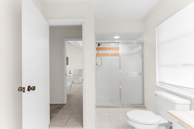 bathroom with tile patterned flooring, an enclosed shower, and vanity