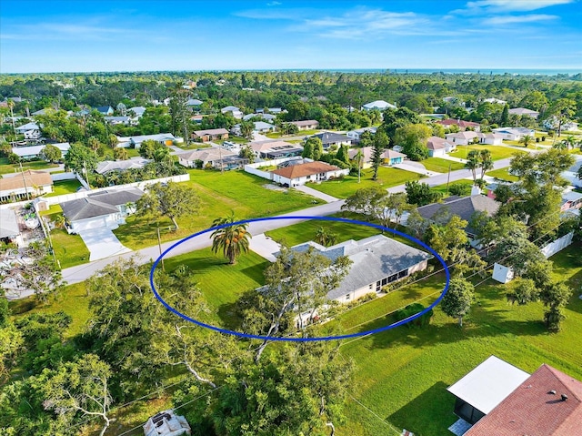 birds eye view of property with a residential view