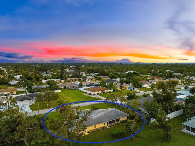 aerial view at dusk with a residential view