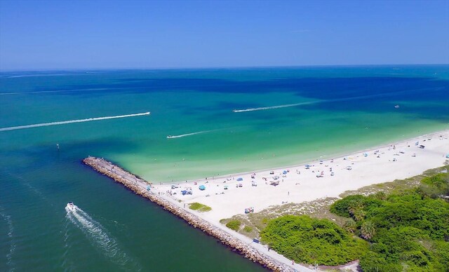 aerial view with a water view and a view of the beach