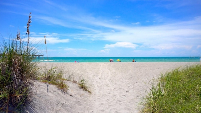 property view of water featuring a beach view