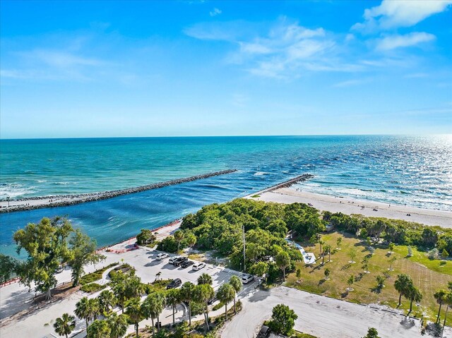 birds eye view of property featuring a view of the beach and a water view