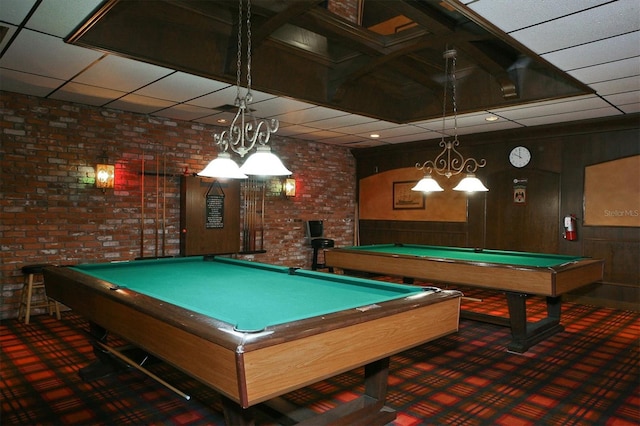 rec room with pool table, carpet, wooden walls, and brick wall