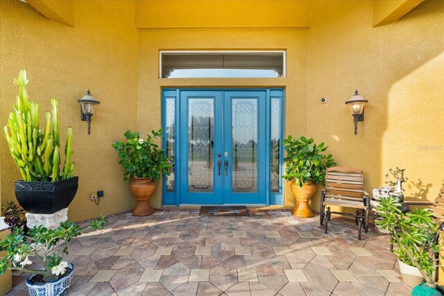 doorway to property featuring french doors