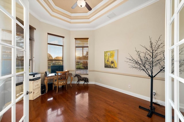 office with wood-type flooring, a tray ceiling, ceiling fan, french doors, and ornamental molding