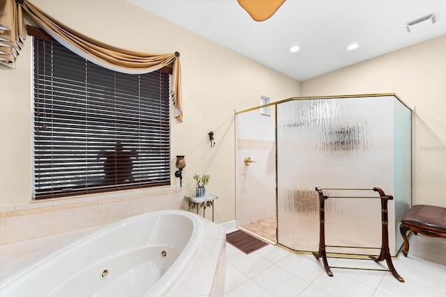 bathroom with tile patterned floors and plus walk in shower