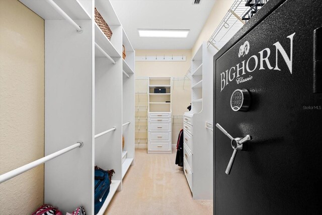 laundry area featuring light colored carpet